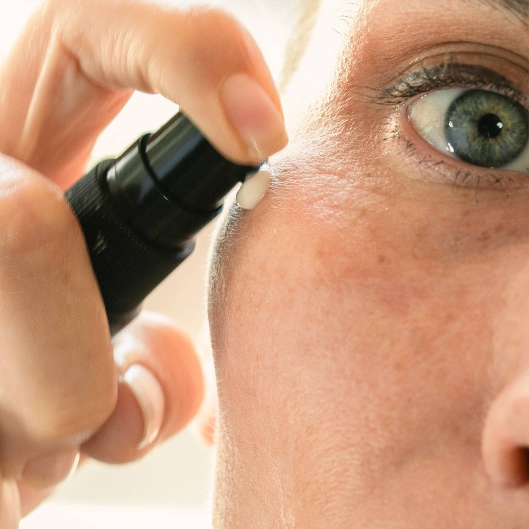 Aureterra Botanical Peptide Cream being applied to the face, showing lightweight, absorbent texture.