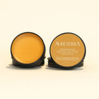 1 oz metal tin with orange salve for natural inflammation relief containing comfrey and cayenne